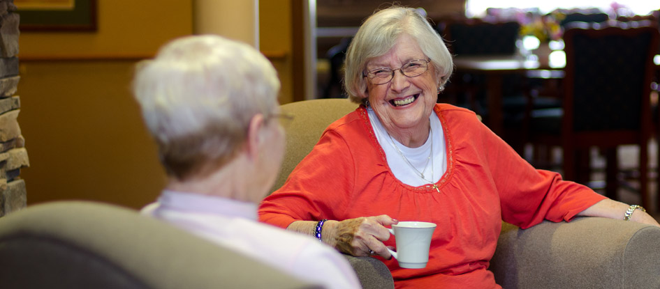 elderly friends having coffee